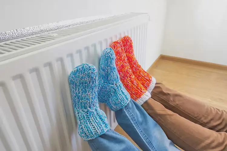 cozy socks against heating unit